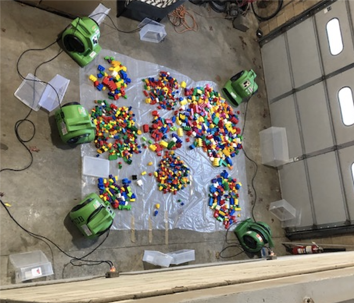 legos surrounded by green drying equipment